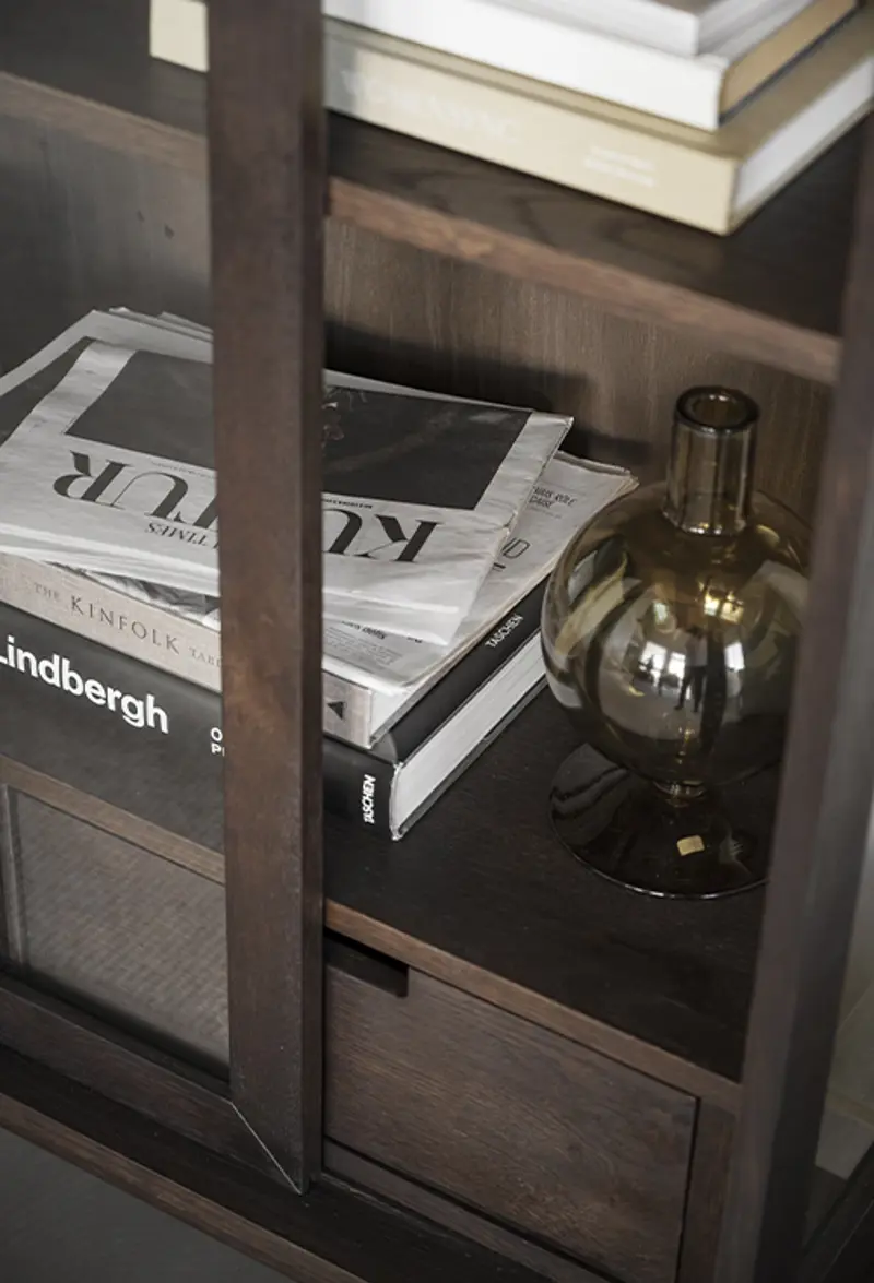 Hazelton glas cabinet storage closeup books.