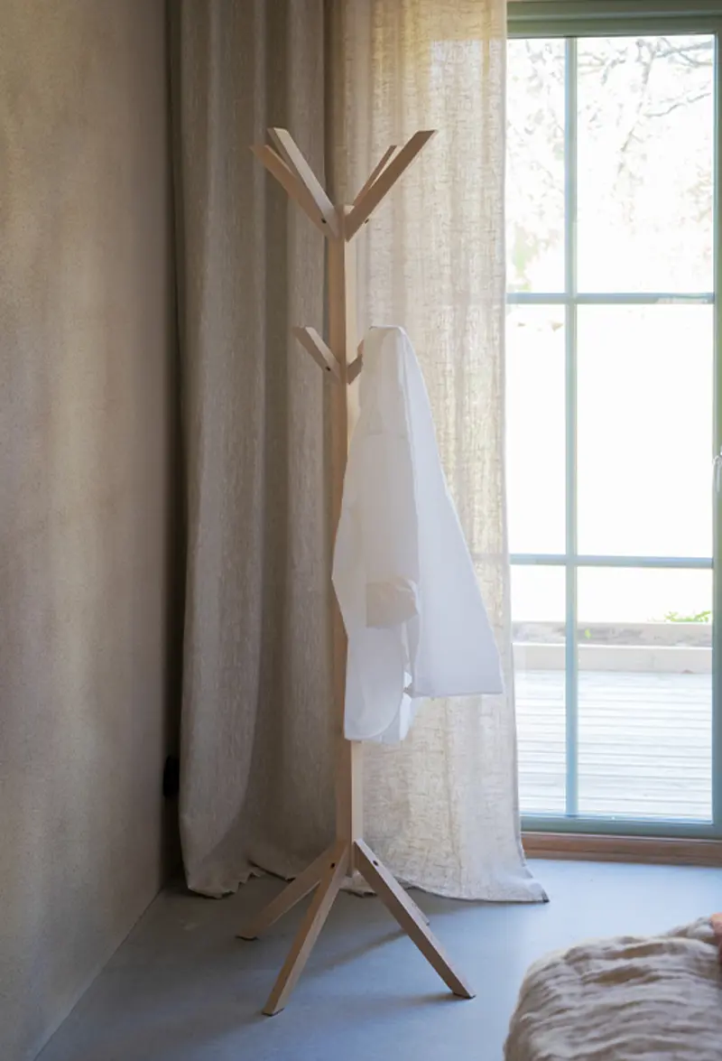 Confetti clothes hanger white wash bedroom.