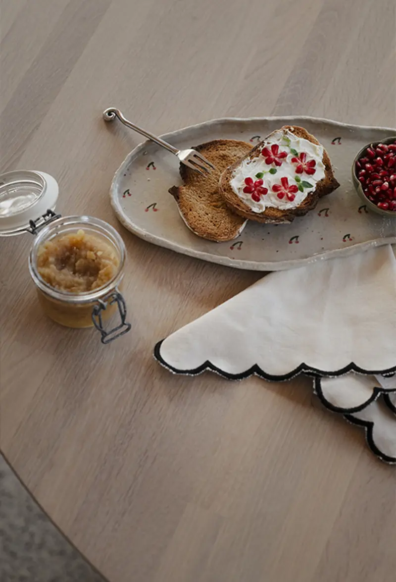 Closeup clapperton dining table round table top.