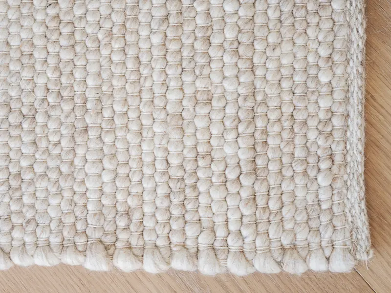 Auckland wool rug closeup beige.